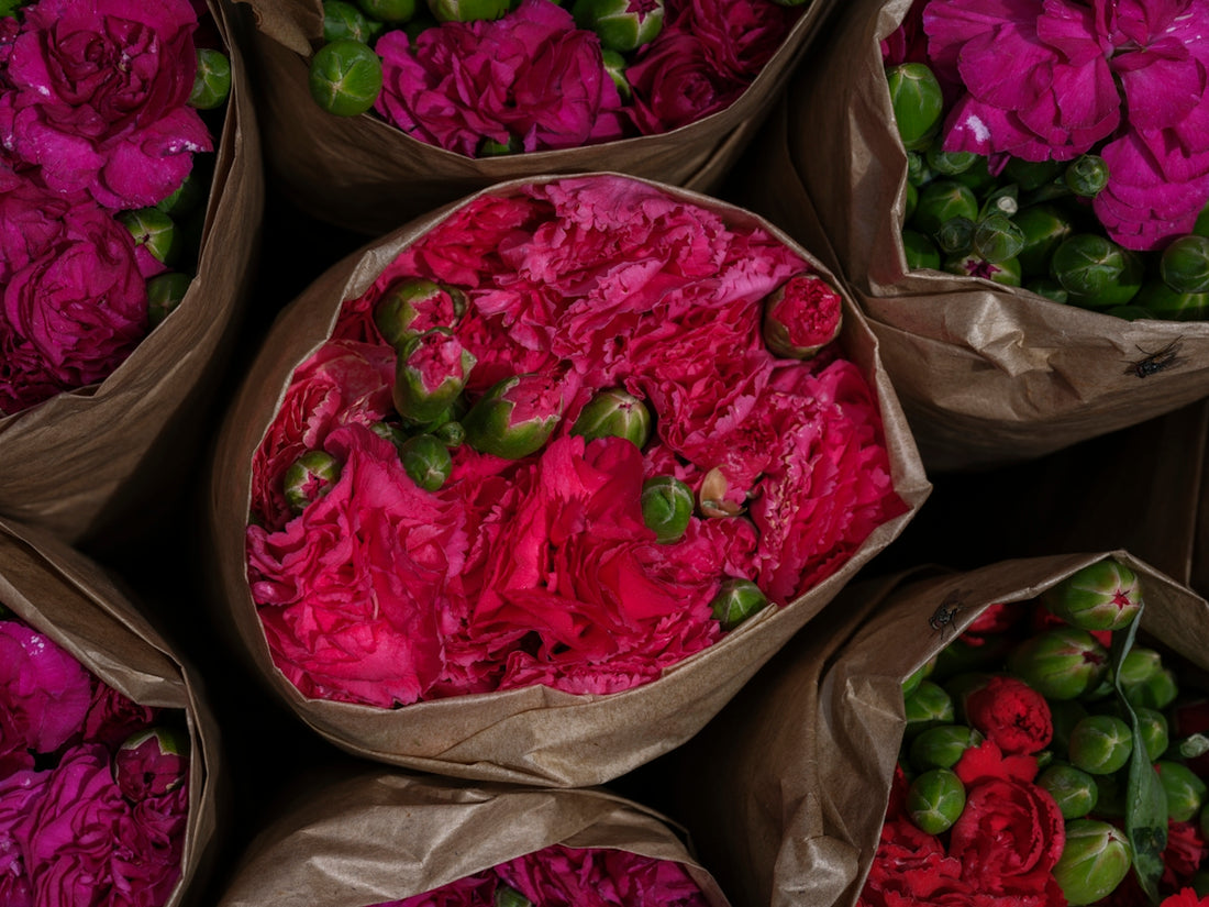 A bunch of bags filled with lots of flowers