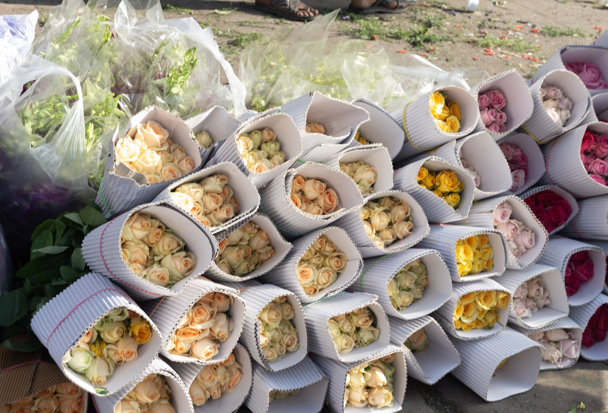 Bundles of flowers are displayed and sold.
