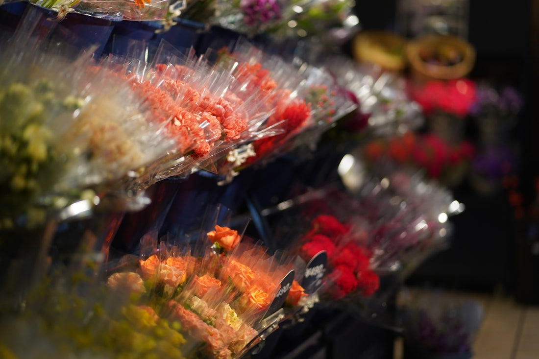 Bundles of colorful flowers wrapped in plastic