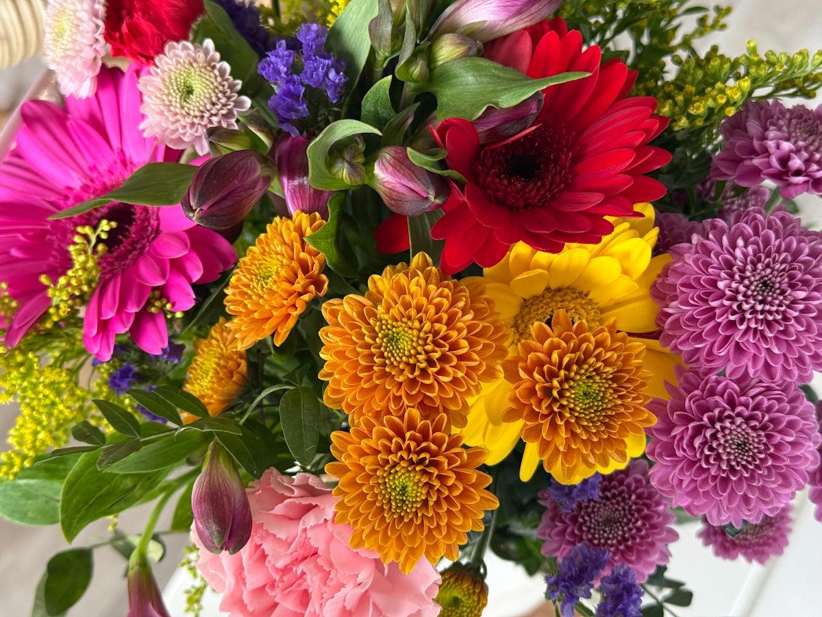 A vibrant bouquet of assorted colorful flowers