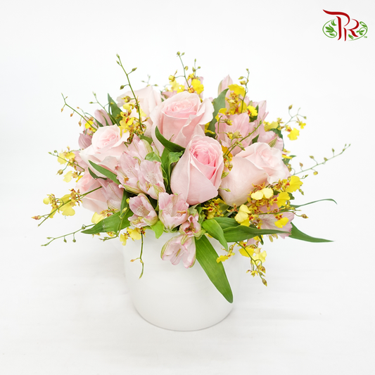 Floral Arrangement In Soft Tone With White Vase